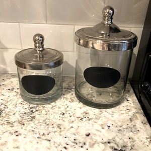 Pottery Barn glass storage jars with sterling silver lids.